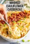 Mashed cauliflower casserole is loaded with cream cheese and cheddar cheese and served with bacon and green onions. This easy recipe is perfect for a low-carb holiday side dish! #cauliflower #lowcarb #glutenfree #holidays #sidedish #Thanksgiving #Christmas