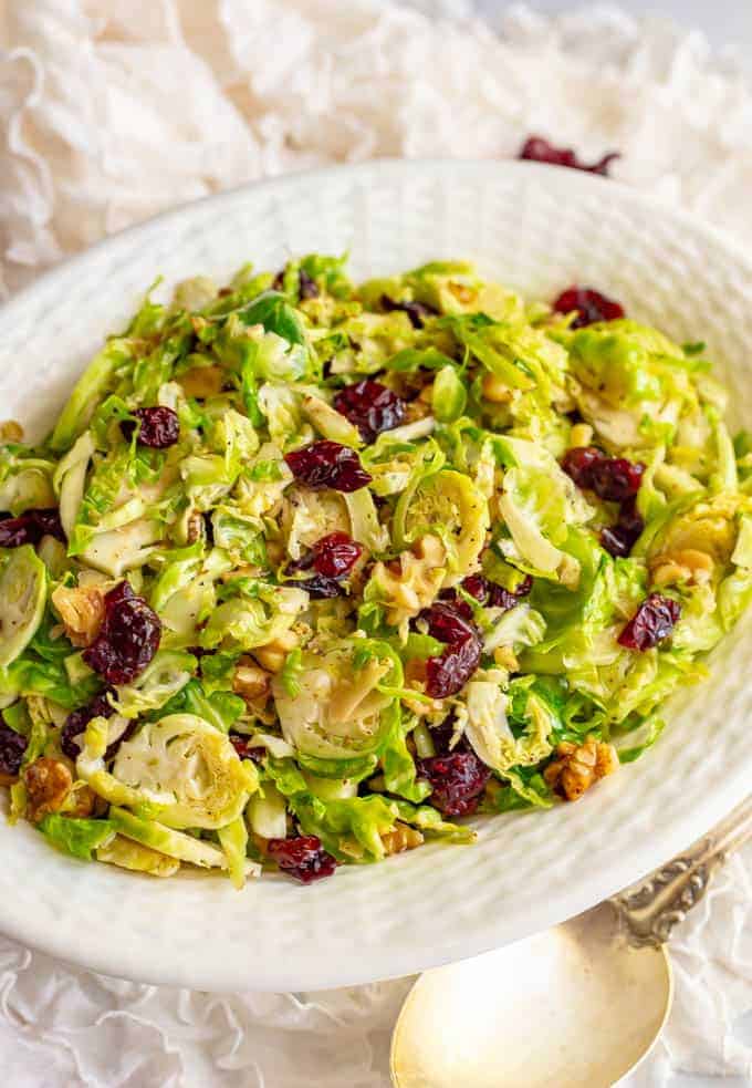 Shredded Brussels sprouts with cranberries and walnuts are a super quick and easy side dish with great flavors! It’s perfect for the holidays or just a busy weeknight! #Brusselssprouts #sidedish #veggies #holidays #Thanksgiving #Christmas