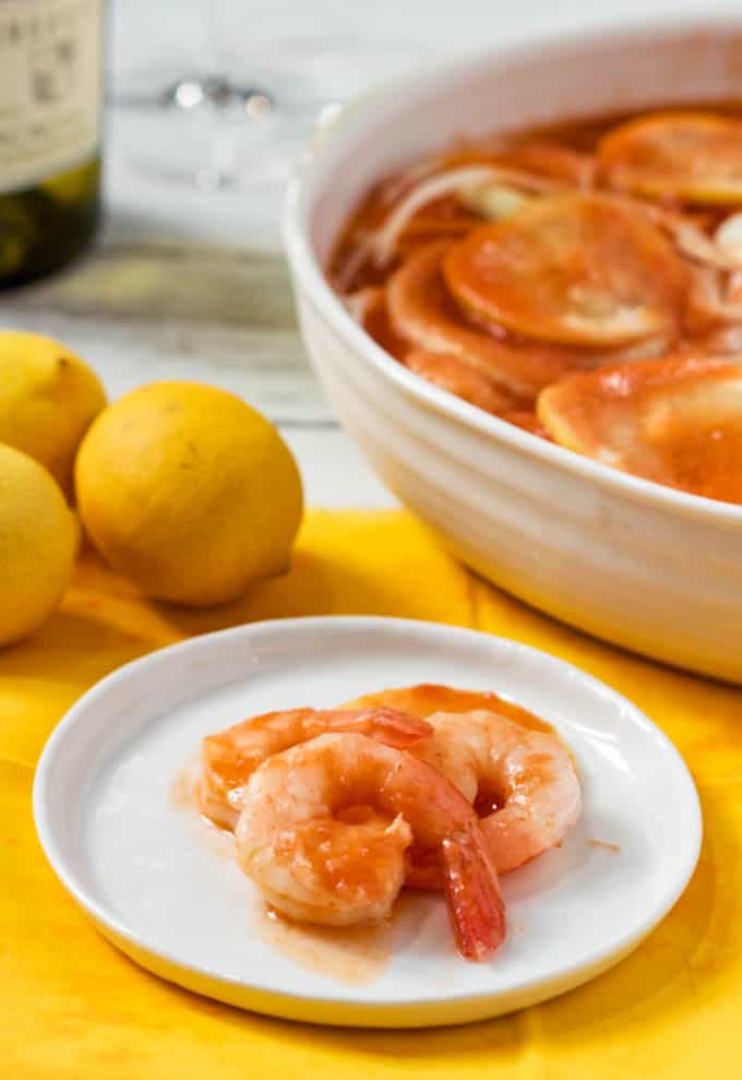 Easy marinated shrimp served on a white plate as a party appetizer