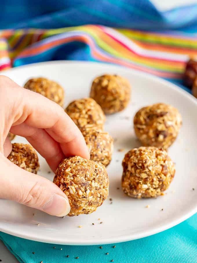 Healthy peanut butter energy balls are just 4 wholesome ingredients and so easy to make! They’re great for a post-workout snack, afternoon snack or on-the-go energy boost! #energyballs #peanutbutter #healthysnack #glutenfreesnack #glutenfreerecipes