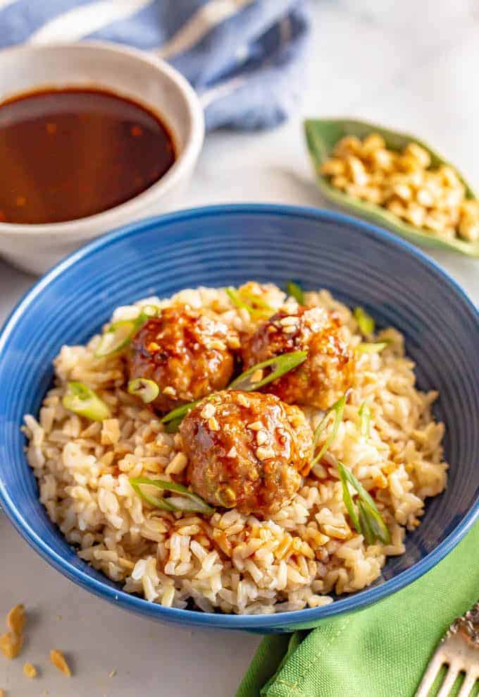 Baked Asian turkey meatballs are tender, flavor-packed and served with an easy, irresistible hoisin-based sauce. Perfect for meal prepping or a quick weeknight dinner that’s ready in under 30 minutes! #groundturkey #meatballs #easydinner