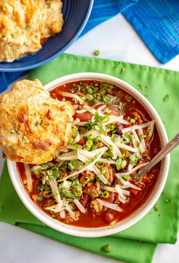 The best game day chili is loaded with ground turkey and beef, two kinds of beans, tomatoes and the perfect blend of spices for an easy, but rich and satisfying chili. Everyone will be going back for seconds! #chili #gamedayeats #healthychili #easychili