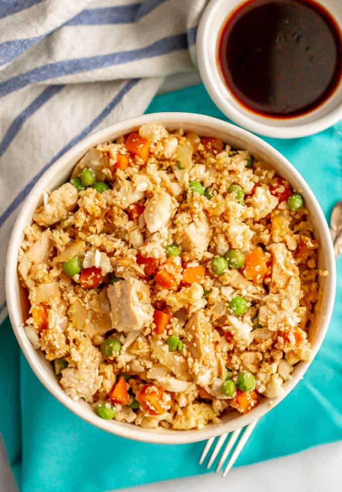 Quick and easy cauliflower fried rice with chicken is a delicious, colorful and flavorful low-carb dinner that comes together in just 20 minutes! #cauliflower #friedrice #lowcarbrecipes #easychickenrecipes