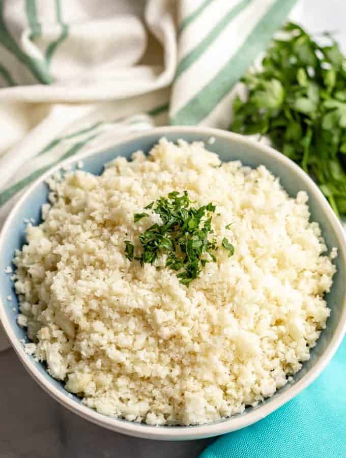 Cauliflower rice is quick and easy to make at home and is great for a healthy, low-carb side dish. It’s naturally gluten-free and great for vegan, paleo and whole-30 eating. #cauliflower #lowcarb #paleorecipes #whole30recipes