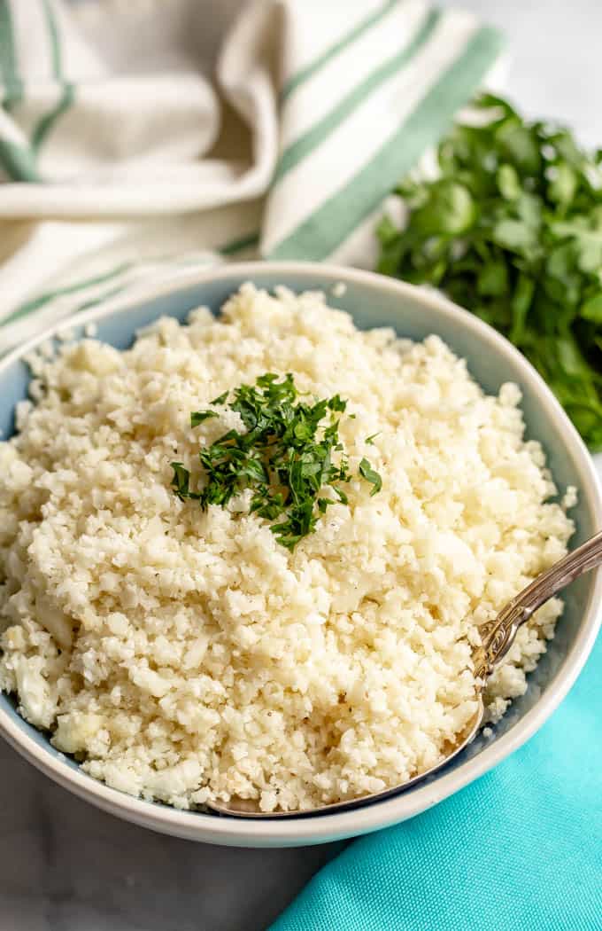 Cauliflower rice is quick and easy to make at home and is great for a healthy, low-carb side dish. It’s naturally gluten-free and great for vegan, paleo and whole-30 eating. #cauliflower #lowcarb #paleorecipes #whole30recipes