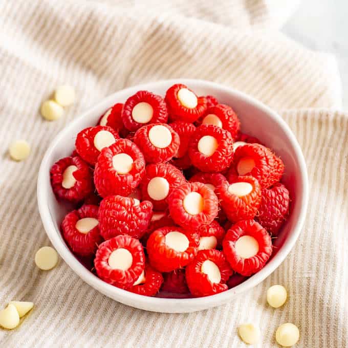 Raspberries stuffed with white chocolate chips for an easy, fun and healthy Valentine's Day snack