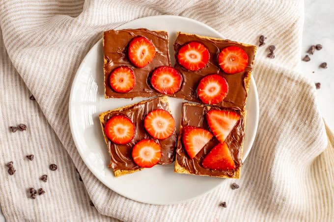 Graham crackers with Nutella and sliced strawberries for an easy, fun Valentine's Day snack for kids