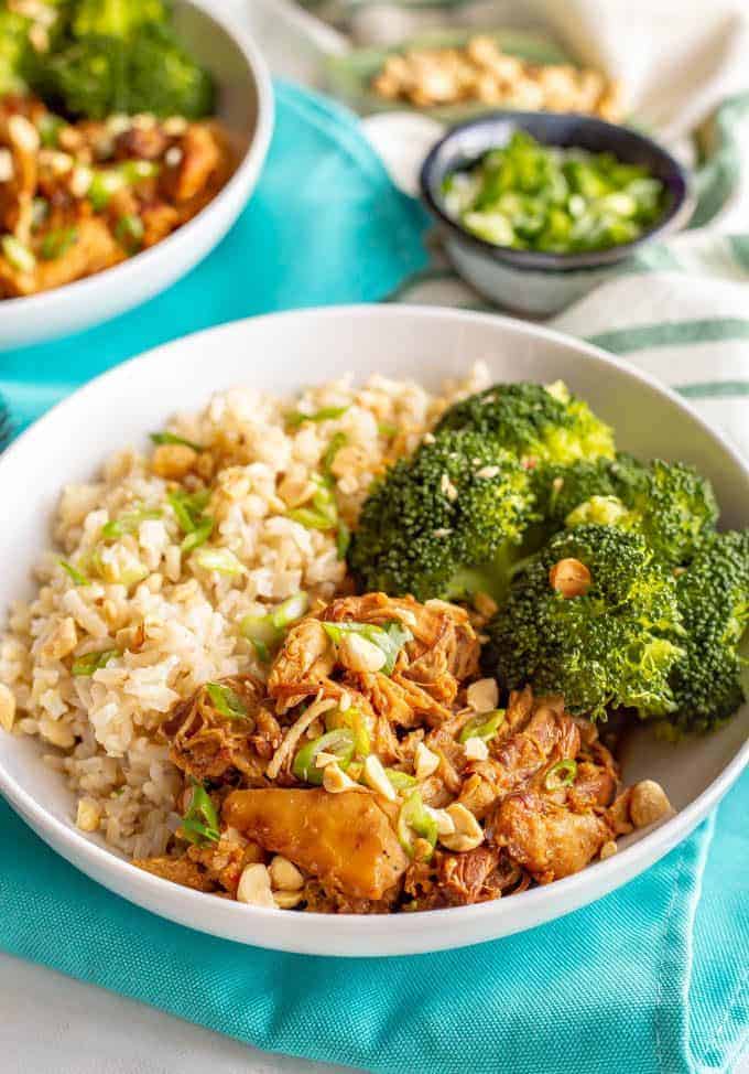 Honey garlic chicken rice bowls with brown rice and steamed broccoli are simple and full of flavor. Drizzle extra sauce over your entire plate and be ready to dig in! #chickendinner #ricebowl #grainbowl #healthychickenrecipes #mealprep