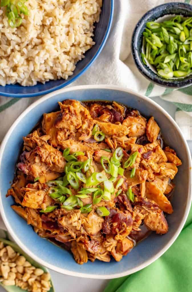 Slow cooker honey garlic chicken is just 5 ingredients and minutes to prep and smells amazing as it cooks! You’ll want to drizzle this delicious sauce over your whole plate! #slowcookerrecipes #chickendinner #slowcookerchicken #crockpotchicken #easychickenrecipes