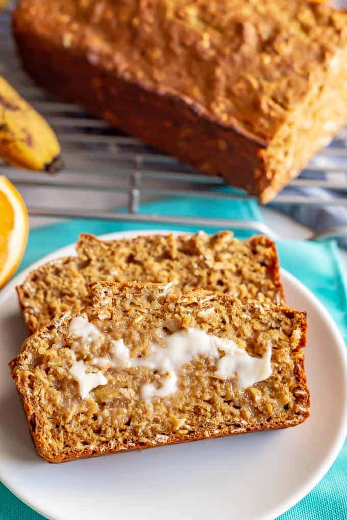 Whole grain banana applesauce bread is naturally sweetened and made without butter or oil. This easy, light and wholesome bread is perfect for a healthy breakfast or snack. #bananabread #healthybaking #healthybreakfast