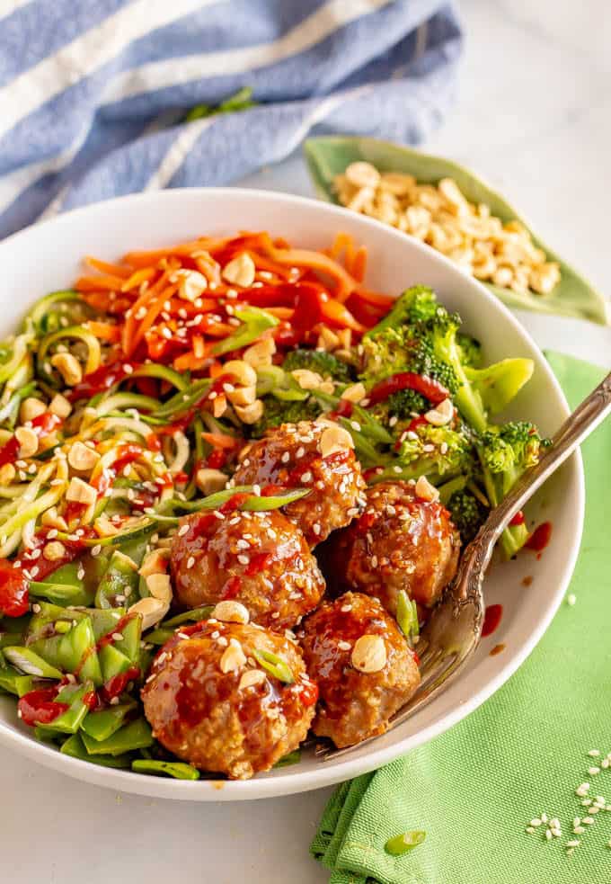 Asian turkey meatballs with veggies served in a large white bowl