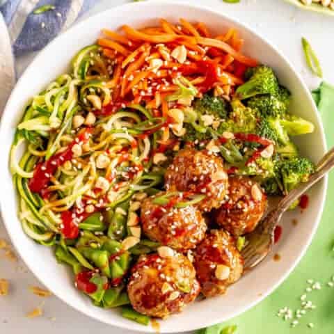 Asian turkey meatballs and veggie bowls are loaded with colorful veggies and finished with a delicious hoisin-based sauce that will have you diving in for more! #veggiebowls #meatballs #mealpreprecipes