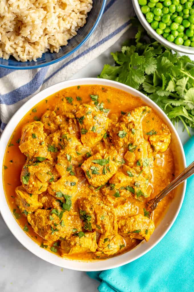 Healthy butter chicken is a delicious Indian dish with tender chicken pieces swimming in an amazing, creamy tomato curry sauce that’s packed with spices and flavor. This easy recipe is ready in 30 minutes! #butterchicken #Indianrecipes #easychickendinners