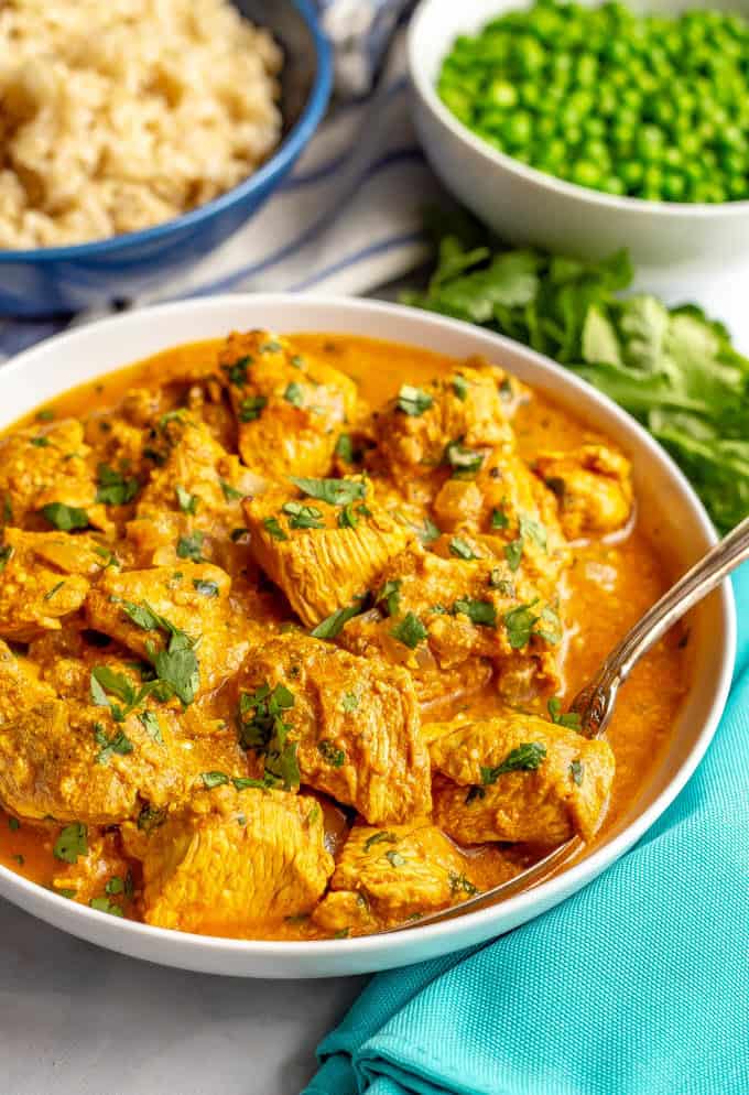 Easy butter chicken served in a creamy tomato sauce in a white bowl