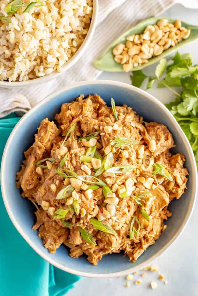 Slow cooker peanut chicken is quick and easy to prep, just 7 ingredients and comes out coated in a delicious peanut sauce! Great for meal prepping or an easy weeknight dinner! #slowcookerrecipes #slowcookerchicken #peanutchicken #mealprep #easydinnerideas