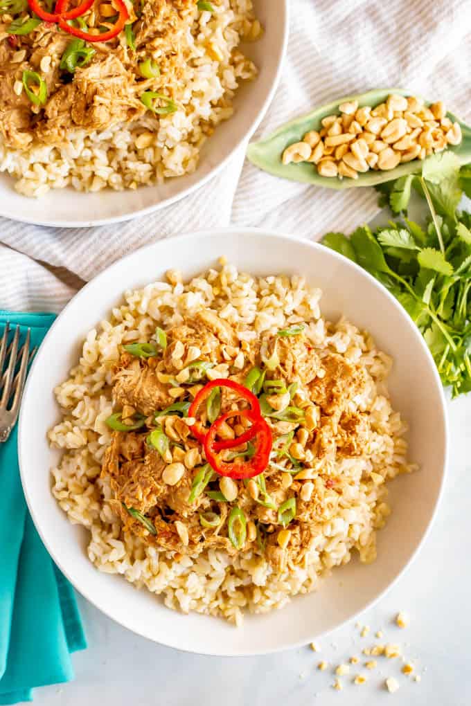 Slow cooker peanut chicken is quick and easy to prep, just 7 ingredients and comes out coated in a delicious peanut sauce! Great for meal prepping or an easy weeknight dinner! #slowcookerrecipes #slowcookerchicken #peanutchicken #mealprep #easydinnerideas