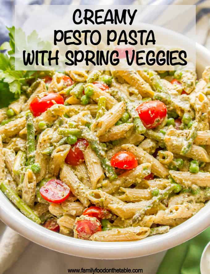 This warm and creamy pesto pasta with spring vegetables is an easy one-pot pasta recipe with peas, asparagus, and ricotta and Parmesan cheeses. It’s great as a light vegetarian meal or as a side dish at dinner! #pestopasta #vegetarianpasta #springpasta
