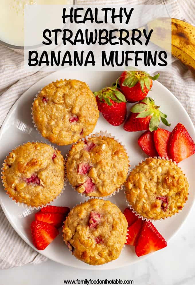 Healthy strawberry banana muffins are whole grain and naturally sweetened and perfect for a fruit-filled breakfast, lunch or snack time treat! Kids love them! #muffins #kidfood #strawberries #ripebananas #healthykids