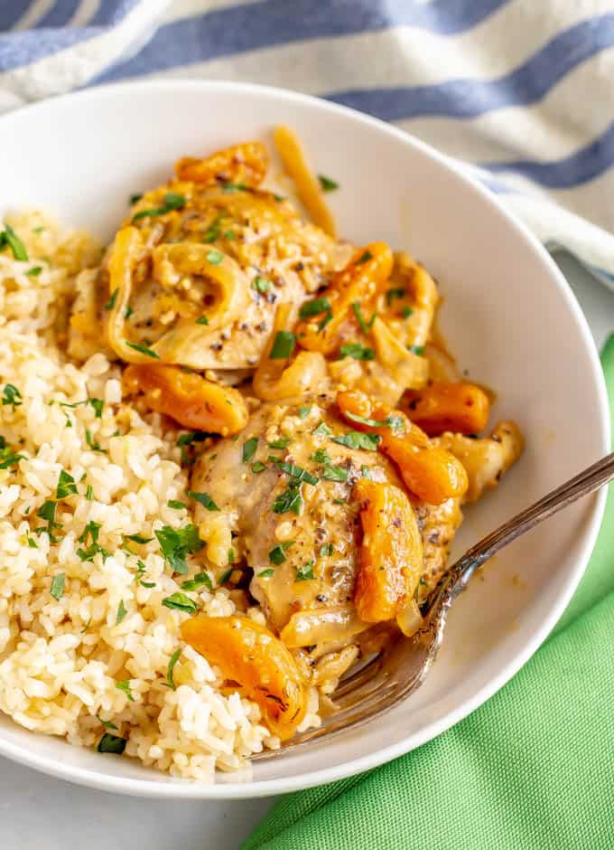 Skillet apricot chicken is an easy, 30-minute recipe using chicken thighs and dried apricots for a delicious dinner with big, fresh flavors and a creamy, dreamy sauce. #easychickenrecipes #chickendinner #apricots #chickenthighs