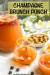A glass pitcher of a bubbly punch alongside several poured stemless wine glasses of it with rims of sugar.