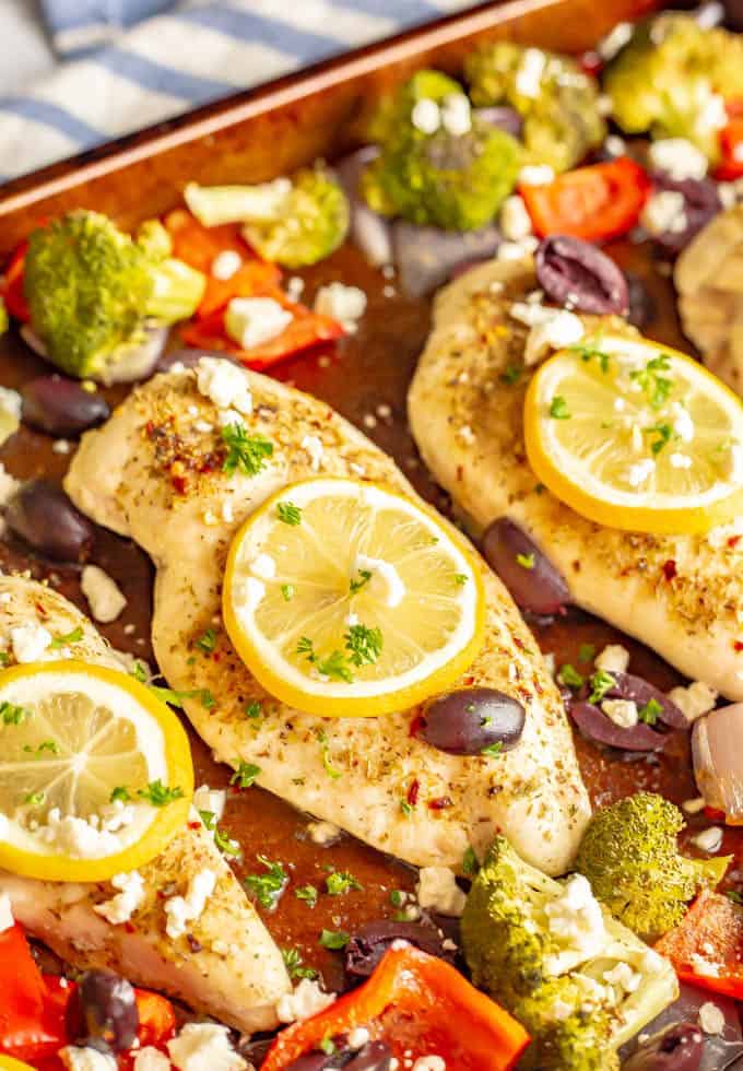 Sheet pan Mediterranean chicken and veggies are seasoned with a yummy spice mixture and roasted together for an easy, healthy, hands-off dinner. #mediterraneanfood #chickenrecipes #chickendinner #sheetpandinner #dinnerideas