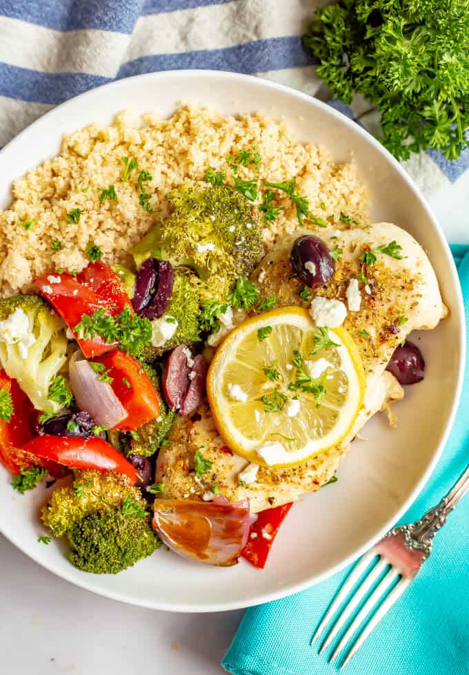 Sheet pan Mediterranean chicken and veggies are seasoned with a yummy spice mixture and roasted together for an easy, healthy, hands-off dinner. #mediterraneanfood #chickenrecipes #chickendinner #sheetpandinner #dinnerideas