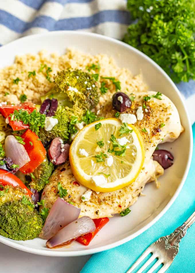 Sheet pan Mediterranean chicken and veggies are seasoned with a yummy spice mixture and roasted together for an easy, healthy, hands-off dinner. #mediterraneanfood #chickenrecipes #chickendinner #sheetpandinner #dinnerideas