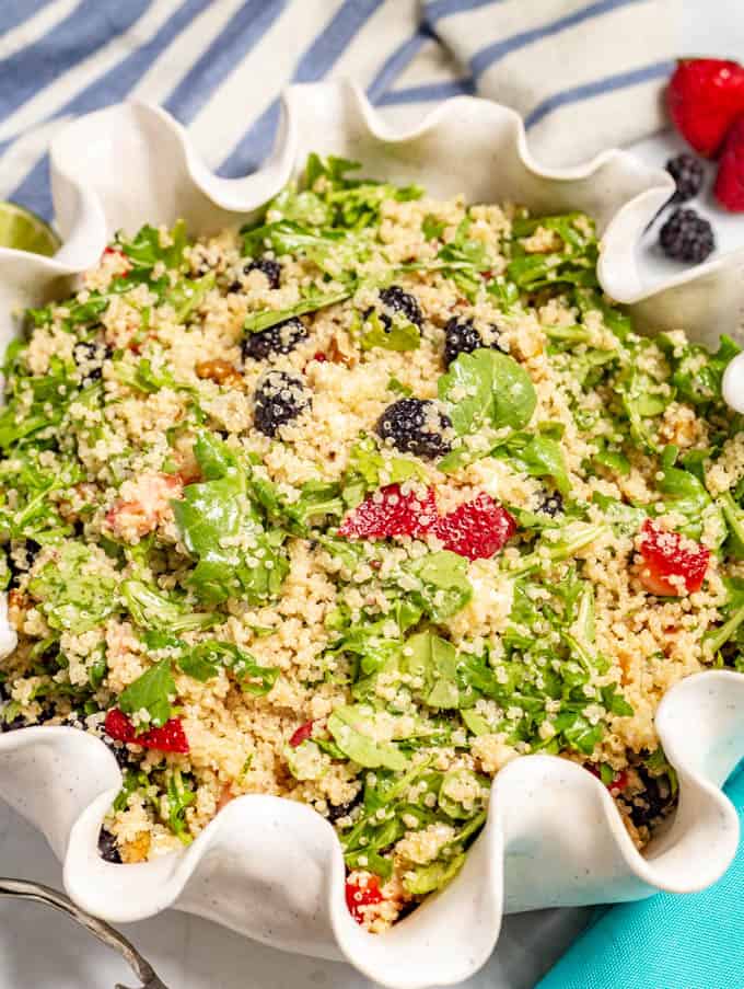 Close up of quinoa and arugula salad with summer berries