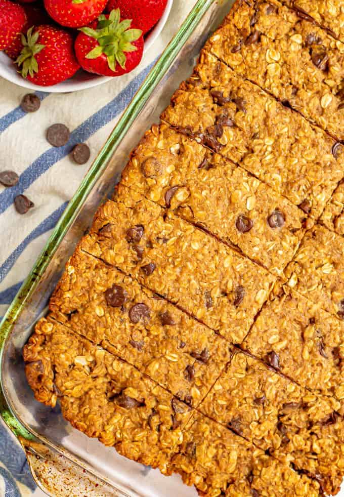 Baked homemade granola bars sliced in the glass pan