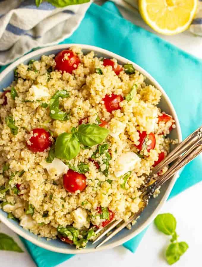 Quinoa salad with tomatoes, mozzarella and fresh basil served in a large bowl
