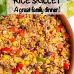 Close up of a copper skillet filled with a ground turkey and rice mixture with zucchini, peppers, black beans and corn.