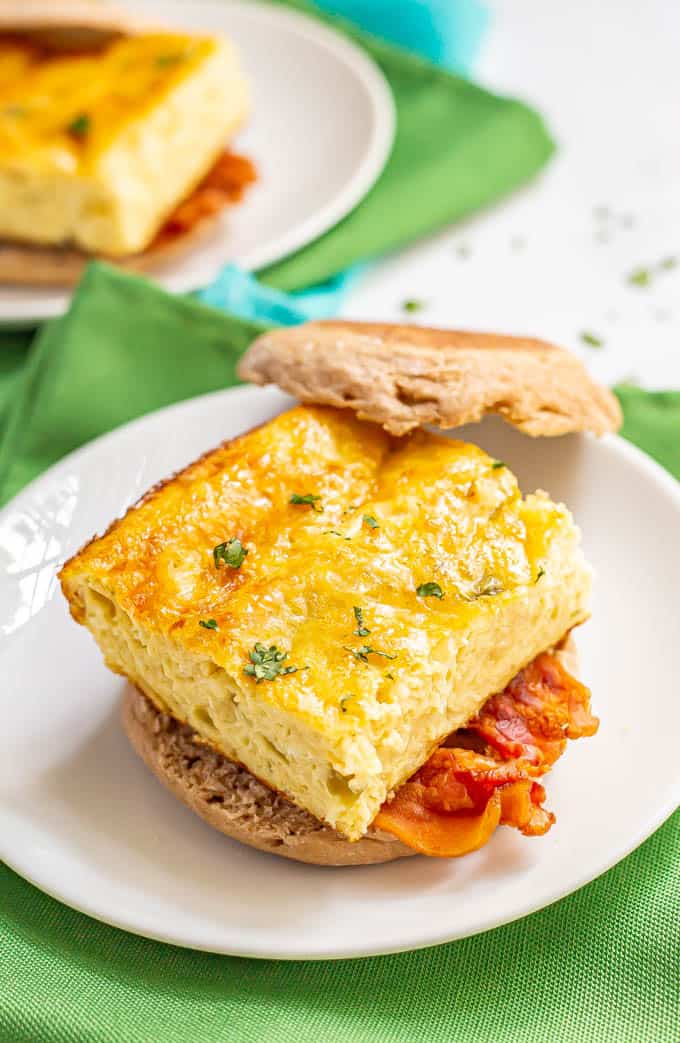 Cheesy egg breakfast sandwich with bacon