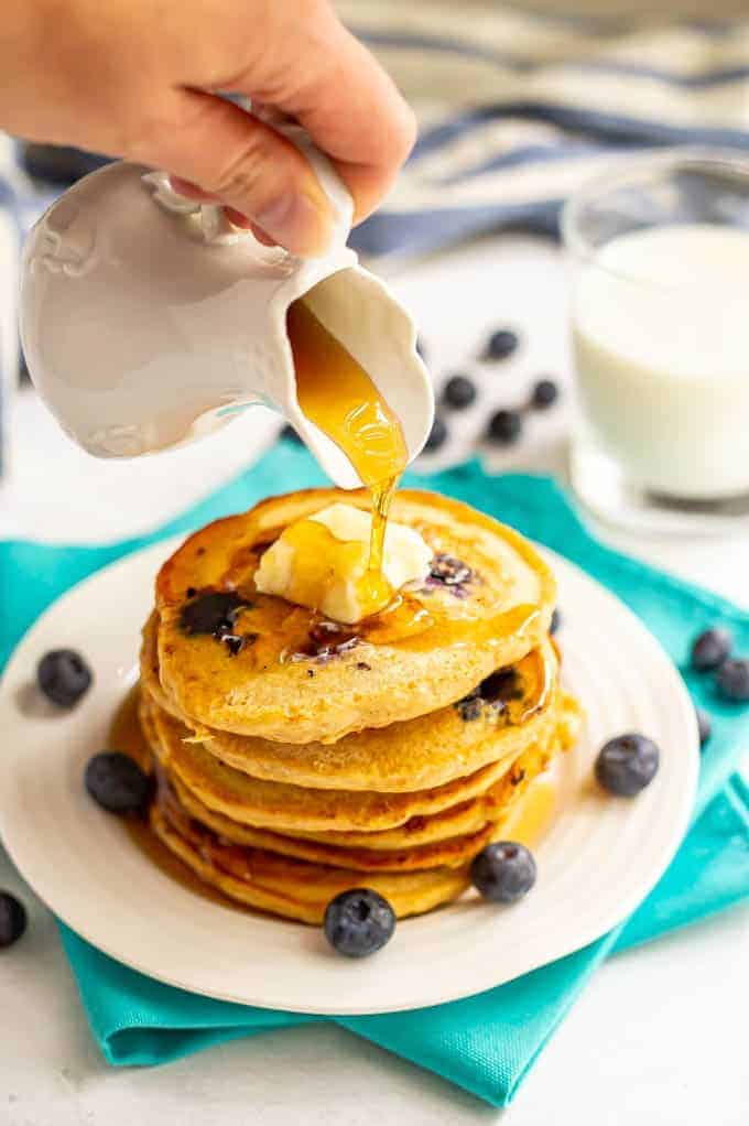 Healthy blueberry pancakes are light and fluffy and bursting with blueberries! These easy 1-bowl pancakes are the perfect way to start your day! #pancakes #blueberries #breakfast #healthyrecipes