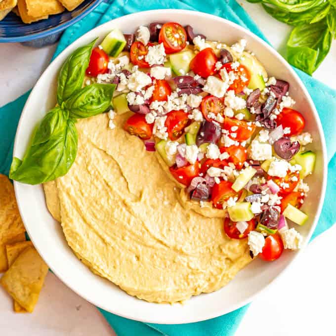 Hummus dip with Greek veggies and feta cheese on top