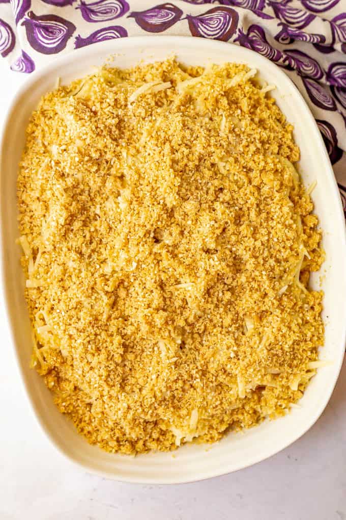 Macaroni and cheese casserole with a breadcrumb topping before being baked