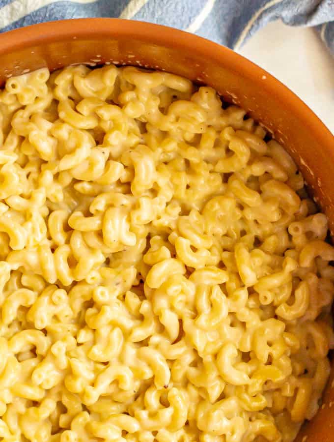 Close up photo of creamy stovetop macaroni and cheese in a large pot
