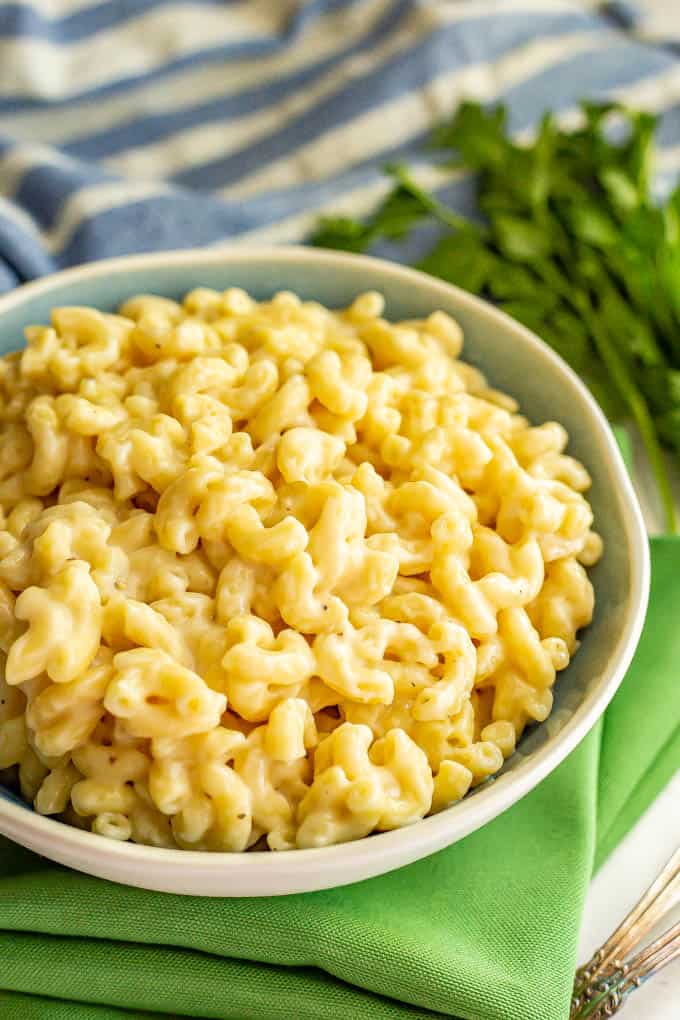 A white and blue bowl filled with easy mac and cheese