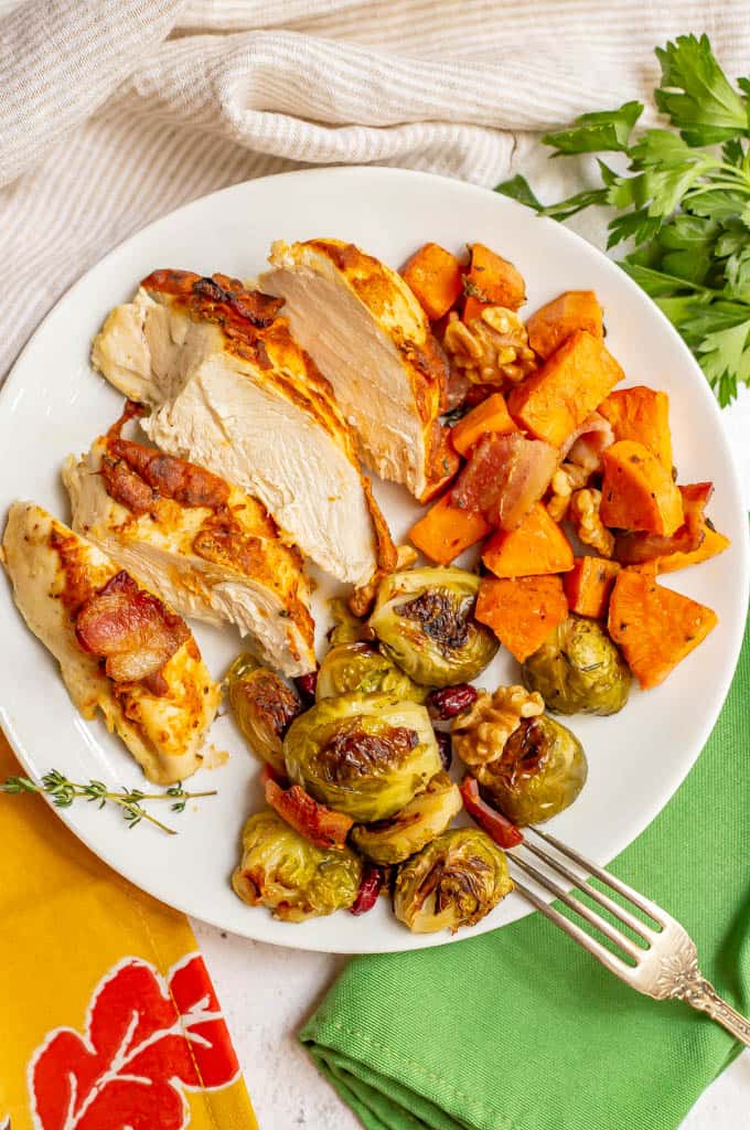 Dinner plate with roasted chicken, sweet potatoes and Brussels sprouts