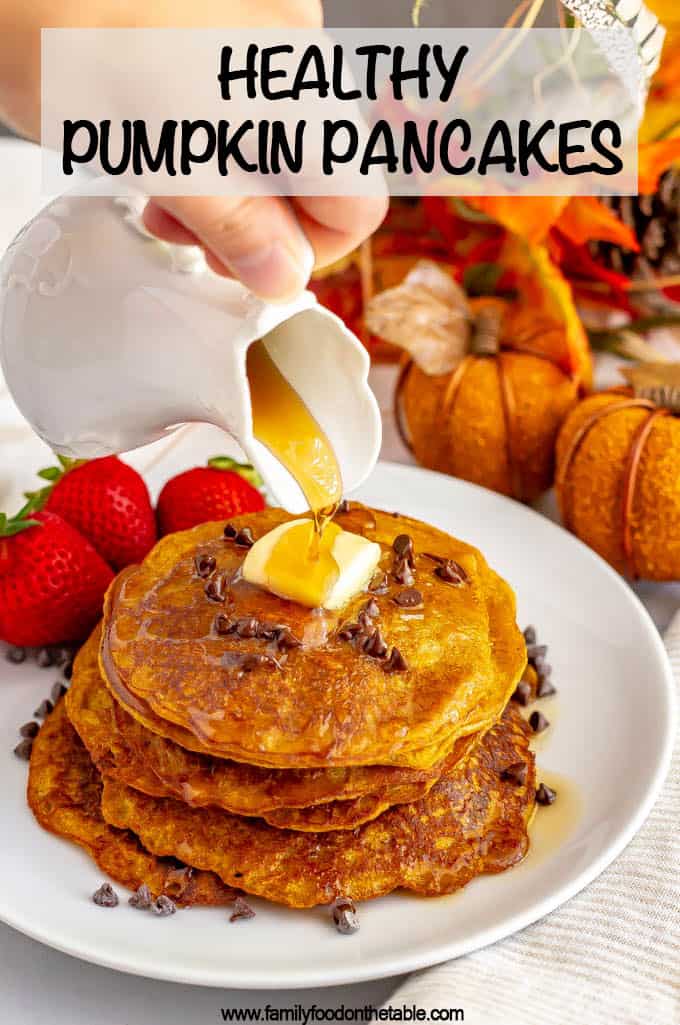 Whole wheat pumpkin pancakes are light, fluffy and full of warm spices and pumpkin flavor. They are naturally sweetened (and can be made vegan) and are perfect for a delicious fall breakfast! #pumpkin #pancakes #breakfast #vegan