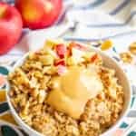 Peanut butter oatmeal with cinnamon and apples