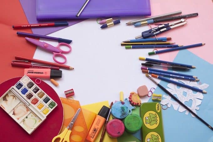 Colorful art supplies spread out on a table