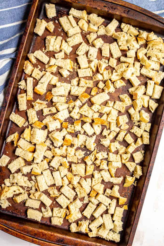 Cubed bread on a baking sheet