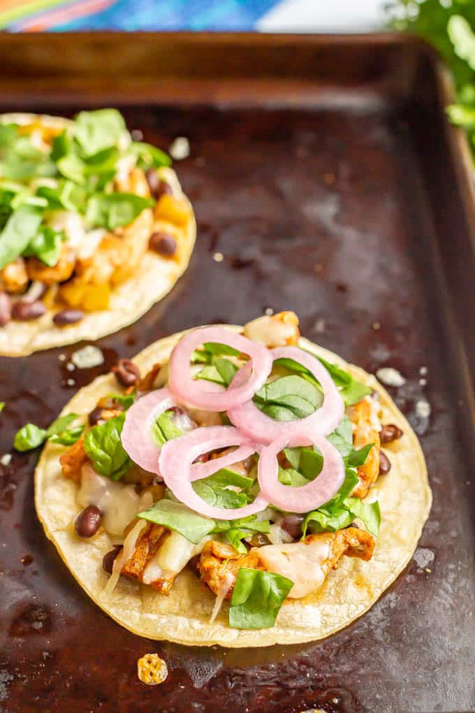 Pork tostadas on a sheet pan after being cooked