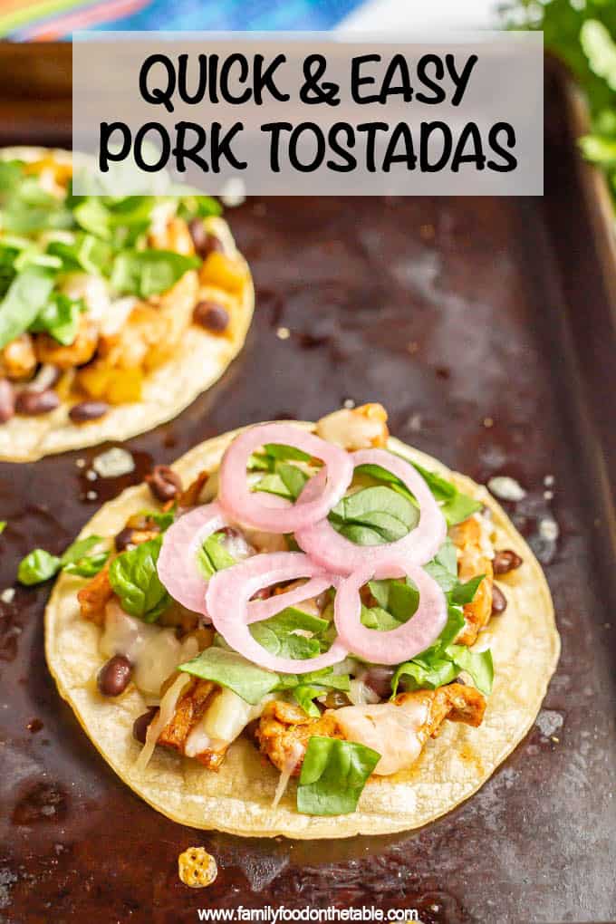 Quick and easy pork tostadas with green chilies, black beans and cheese on baked, crispy corn tostadas are a delicious dinner that’s ready in about 15 minutes! #porkrecipes #easydinner #porkdinner #tostadas #familydinner