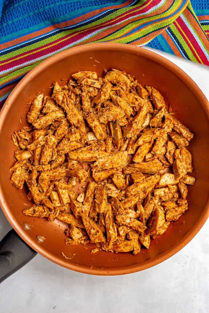 Leftover Thanksgiving turkey strips warmed with taco seasoning in a large skillet