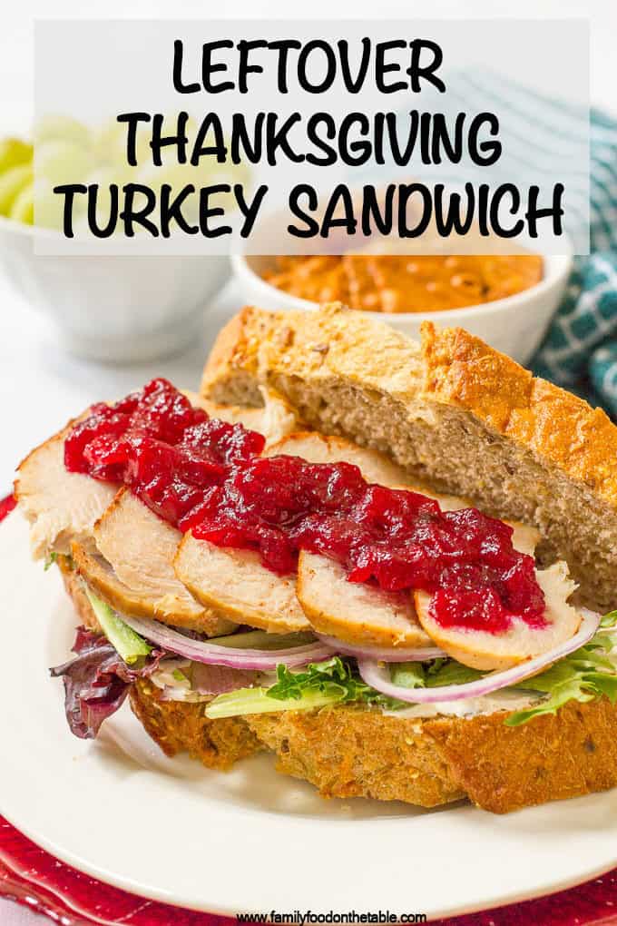 Leftover Thanksgiving turkey sandwiches with cream cheese, cranberry sauce, greens and red onion are a delicious easy lunch and a great way to use leftovers! #thanksgiving #leftoverturkey #turkeysandwich #lunchideas