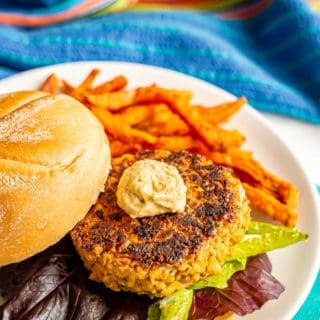 Easy chickpea burgers come together quickly, are sturdy while cooking and have delicious flavor! Add your favorite toppings and use these vegetarian burgers for burgers, wraps, on salads or in grain bowls at lunch or dinner. #chickpeas #veggieburger #vegetarianrecipes #burgers #healthyeating #healthyrecipes