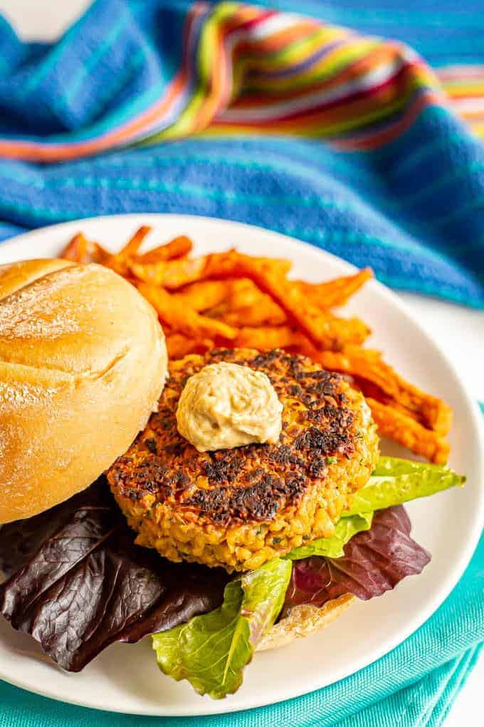 Easy chickpea burgers come together quickly, are sturdy while cooking and have delicious flavor! Add your favorite toppings and use these vegetarian burgers for burgers, wraps, on salads or in grain bowls at lunch or dinner. #chickpeas #veggieburger #vegetarianrecipes #burgers #healthyeating #healthyrecipes