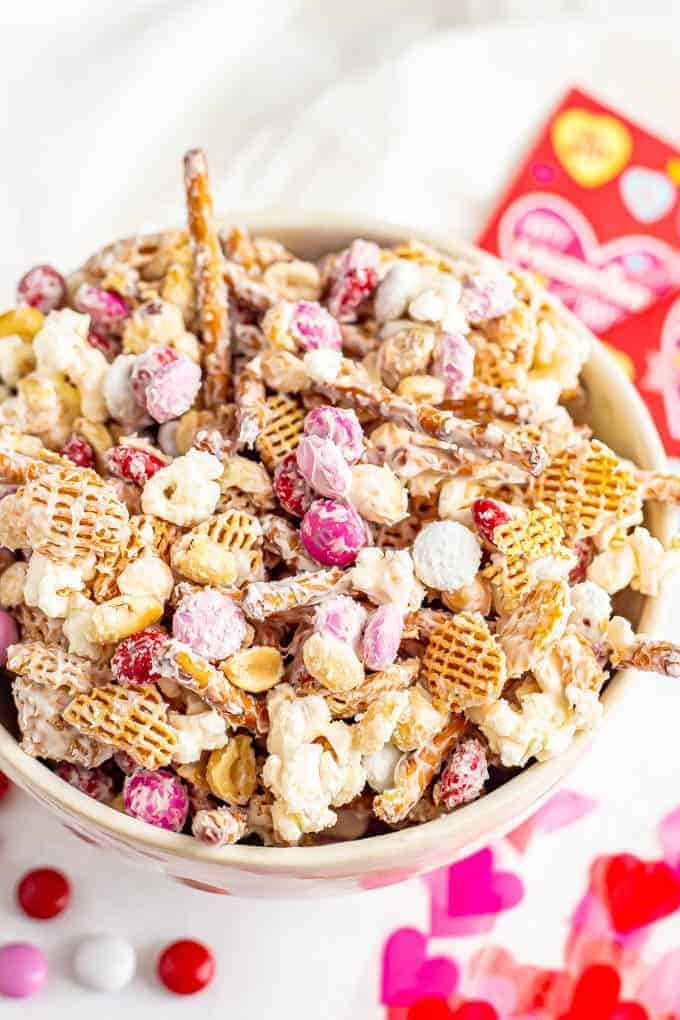 A bowl full of Cupid's Crunch snack mix with Valentine's M&Ms