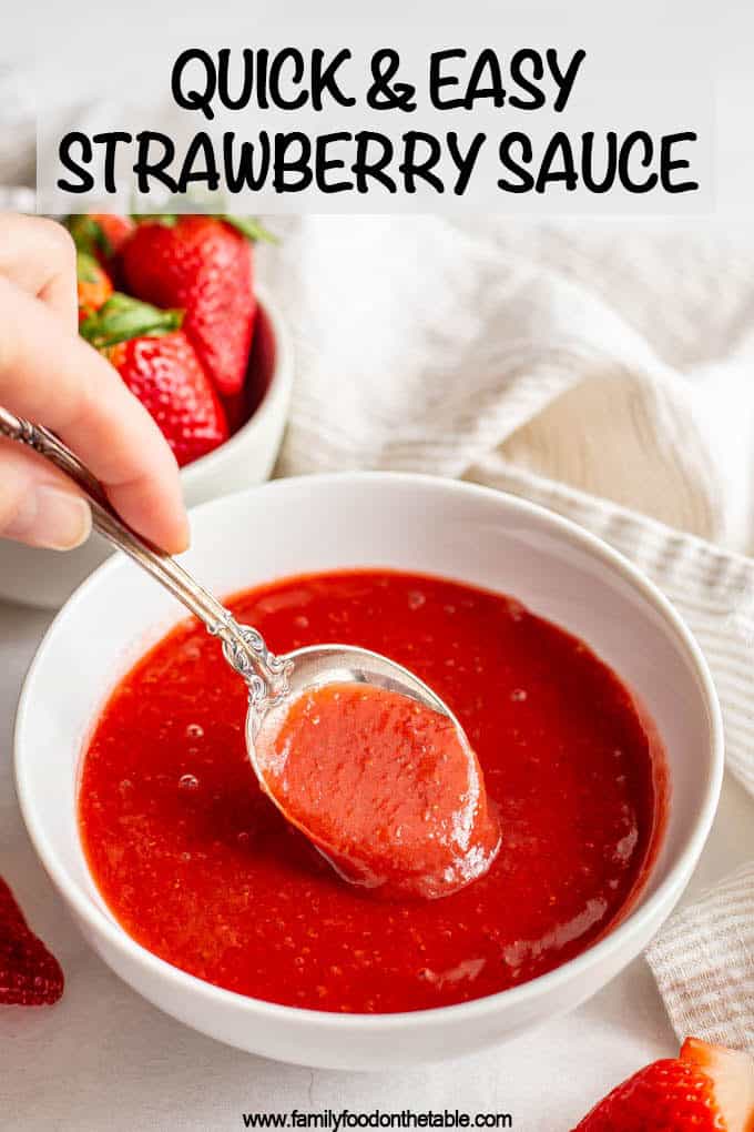 A spoonful of strawberry sauce being taken from a bowl with a text box at top